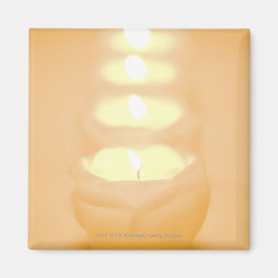 Eine Reihe der beleuchteten Kerzen Magnet