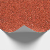 Eine Rolle orangefarbenes Dachmaterial mit einer t Geschenkpapier (Ecke)