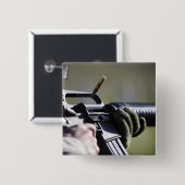 Eine Rundfliege aus der Kammer eines M-16A2 Button (Vorne & Hinten)