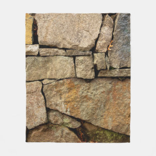 Eine Steinmauer aus Kopfsteinpflaster-Hintergrund Fleecedecke