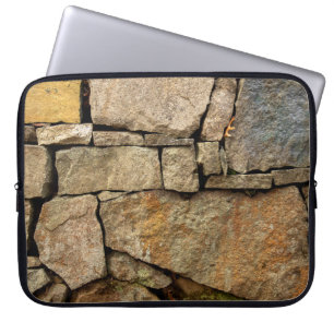 Eine Steinmauer aus Kopfsteinpflaster-Hintergrund Laptopschutzhülle