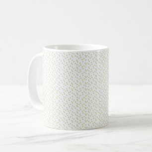 Eine Streuung von hellgrünen Quadraten auf Weiß. Kaffeetasse