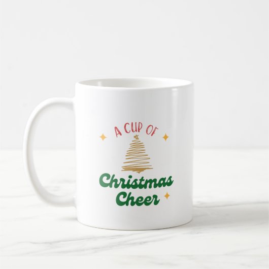 Eine Tasse Weihnachtsjubeln mit Goldbaum (Links)