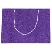 Eine violette Geschenktüte mit Glitter und einem w (Vorderseite)