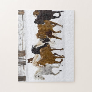 Eine Winterlandschaft mit galoppierenden Pferden Puzzle