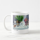 Eine wirkliche Katze und einiges Kaffeetasse (Links)