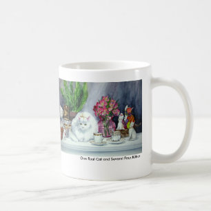 Eine wirkliche Katze und einiges Kaffeetasse