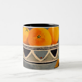Eine wunderschöne Tasse mit Orangenmalerei