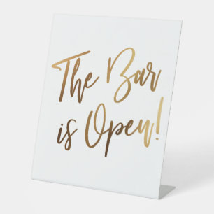 Einfache Gold-Handschrift-Typografie Die Bar ist g Sockelschild