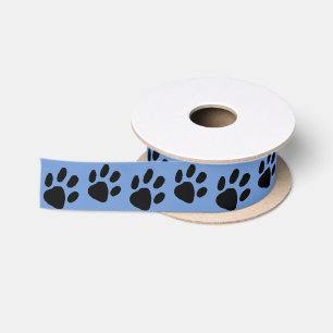 Einfache schwarze Paw-Druck auf blau Satinband
