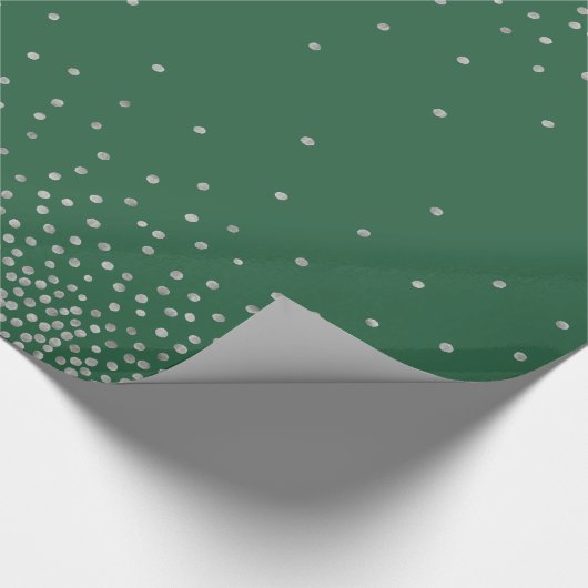 Einfache Silber-Confetti über dunkelgrünes Festiva Geschenkpapier (Ecke)