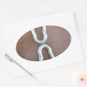 Eingeklemmt: Design der Stahlkarabiner-Verriegelun Ovaler Aufkleber (Umschlag)