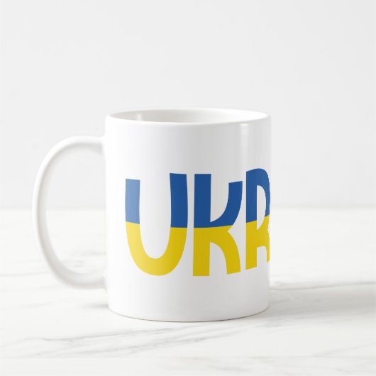 Eintragung in die Ukraine in blau-gelb Farbe Kaffeetasse (Links)