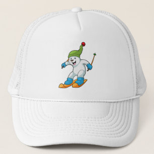 Eisbär als Skifahrer mit Ski- und Bobhut Truckerkappe
