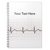 EKG Herzschlag auf Zeichenpapier mit Notizblock (Vorderseite)