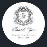 Elegant Monogram Wedding Crest Thank You Runder Aufkleber<br><div class="desc">These elegant classic black and white wedding monogram thank you stickers are perfect for favors, place cards, and more. They feature an ornate vintage crest with intertwined fancy script calligraphy monogram, and script Thank You. Find matching products in the collection, or message me through Zazzle Chat for more products and...</div>
