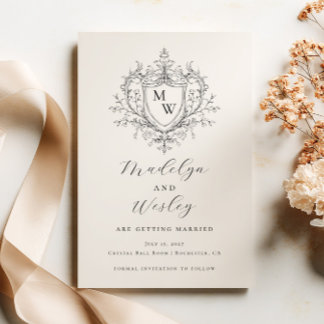 Elegant script monogram crest save the date