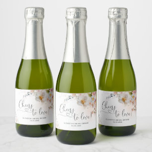 Elegante Brautparty mit Wildblumen Funkelnden Wein Schaumweinetikett