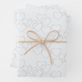 Elegante dekorative Silberherz-Charme auf Weiß Geschenkpapier Set