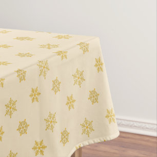 Elegante goldene Schneeflocken auf leichtem Champa Tischdecke