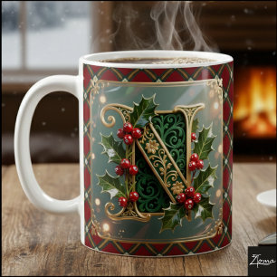 Elegante goldene Stechpalmen-Weihnachtsinitiale Bu Kaffeetasse
