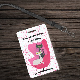 Elegante Katzen in einem rosa Sessel mit Punkten a Ausweis