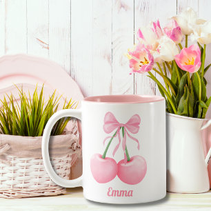 Elegante, moderne rosa Kirschen mit rosa Schleife, Zweifarbige Tasse