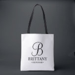 Elegante Personalisierte Bridesmaid in Schwarz und Tasche<br><div class="desc">Elegante Personalisierte Bridesmaid-Geschenke in Schwarz und Weiß mit personalisierten Monogrammen im eleganten Stil der Kalligraphie mit Name und Titel der Brautjungfrau im klassischen Serif-Schriftart-Stil. Auch perfekt für die Trauzeugin,  Blumenmädchen,  Brautmutter und vieles mehr.</div>