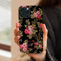 Elegante rosa Rosen mit monogramm-schwarzem Hinter