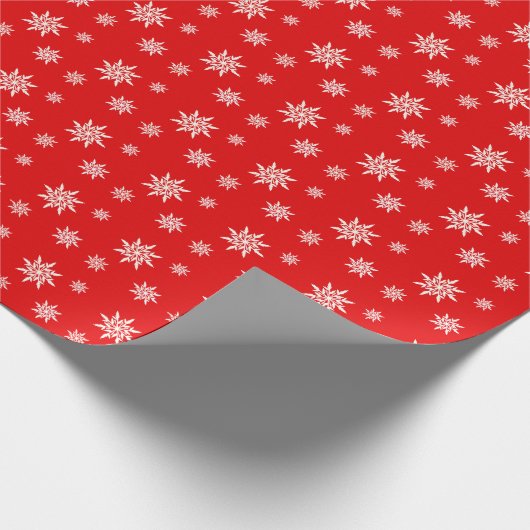 Elegante Schneeflocken auf Rot Geschenkpapier (Ecke)