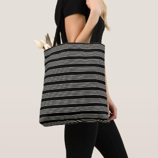 Elegante schwarze und cremefarbene horizontale Str Tasche