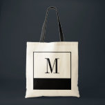 Elegante Schwarzweiss-Monogramm-Tasche Tragetasche<br><div class="desc">Wenn Sie einer Brautjungferntasche oder nach einer einzigartigen personalisierten Brautjungferngeschenkidee suchen, sind diese eleganten kleinen Schwarzweiss-Taschen die Antwort! Die Tasche ist in allen verschiedenen Größen verfügbar, und gekommen in einen weißen Hintergrund mit einem großen schwarzen Farbblock auf der Unterseite. Jede Tasche kann mit der Initiale oder dem Monogramm Ihrer Brautjungfer,...</div>