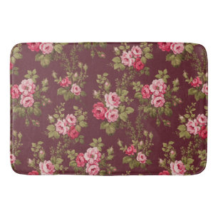 Elegante Vintage Rose im Maroon-Hintergrund Badematte