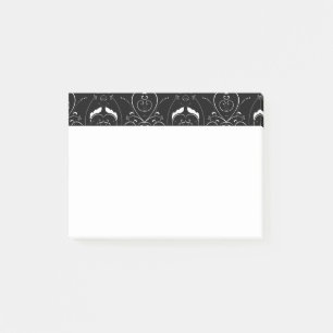 Elegante weiße Schnörkel und Verzierung auf Schwar Post-it Klebezettel