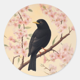 Eleganter Blackbird im Blütenrausch Runder Aufkleber