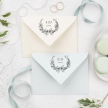 Eleganter blau eingeprägter Blumenreath mit Monogr