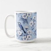 Eleganter blauer Vogel und weißes Blumenmuster Kaffeetasse (Links)