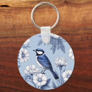 Eleganter blauer Vogel und weißes Blumenmuster Schlüsselanhänger