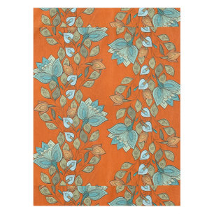 Eleganter bunter Blumenstrudel auf orange Leder Tischdecke