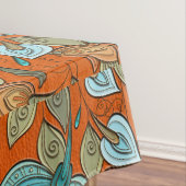 Eleganter bunter Blumenstrudel auf orange Leder Tischdecke (Beispiel)