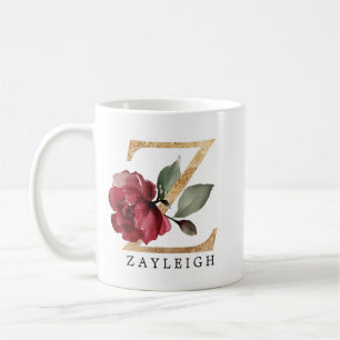 Eleganter goldener burgunderfarbener Blumenbuchsta Kaffeetasse