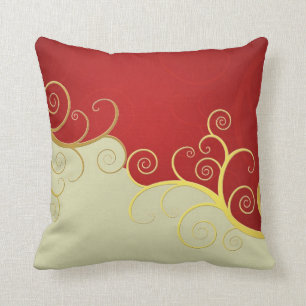 Eleganter goldener Wirbel auf Rot und Creme Kissen