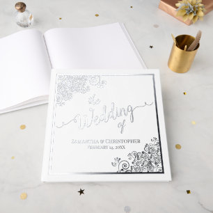 Eleganter kalligrafischer Silberstreifen auf der W Gästebuch