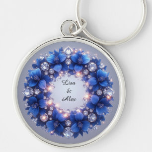 Eleganter Kranz verziert mit blauen Blumen Schlüsselanhänger