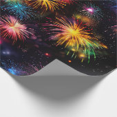 Eleganter Regenbogenfeuerwerk auf schwarzem Hinter Geschenkpapier (Ecke)