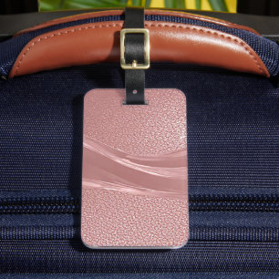 Eleganter rosa Schimmerhintergrund mit metallische Gepäckanhänger