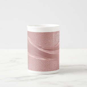 Eleganter rosa Schimmerhintergrund mit metallische Porzellantasse