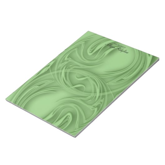 Eleganter Schlaganfall über grünes Abstrakt Notizblock (angewinkelt)