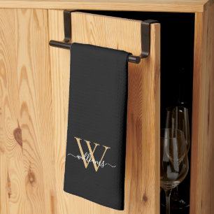 Eleganter Schwarzgold-Schriftzug mit individuellem Geschirrtuch