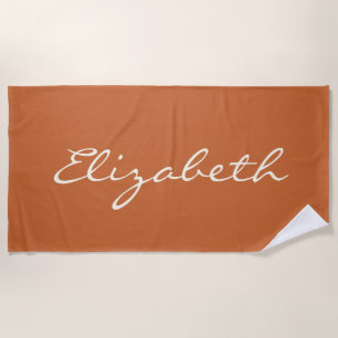 Eleganter verbrannter orangefarbener handgeschrieb strandtuch